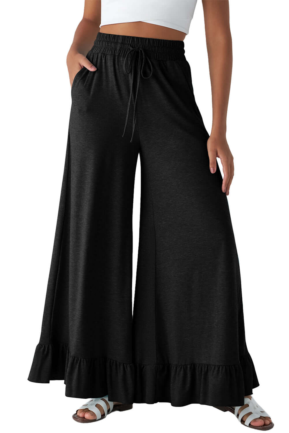 Black CHARMED COMFORT WIDE LEG PANTS with ruffled hem detail for stylish and comfortable wear.