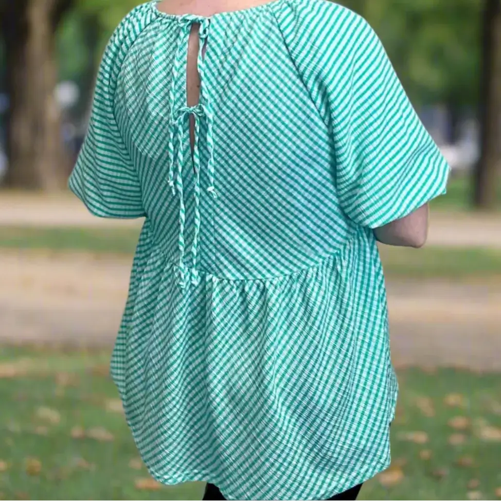 Back view of the Aqua Angles Top by Umgee, featuring turquoise check print and adjustable tie-back.