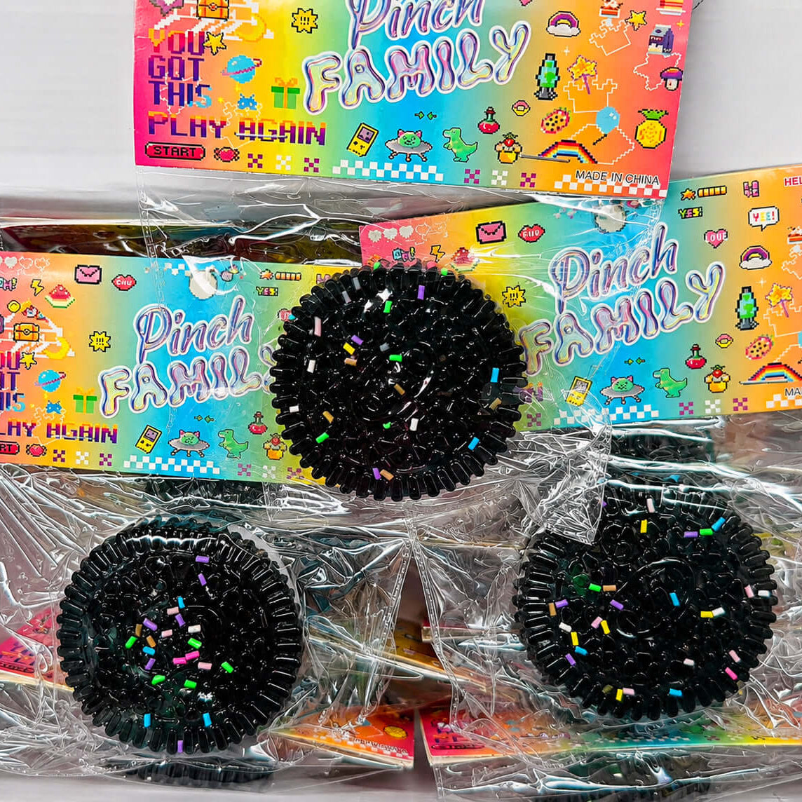 SANDWICH COOKIE SQUISHY products in colorful packaging displayed in a box, perfect for stress relief and sensory play.