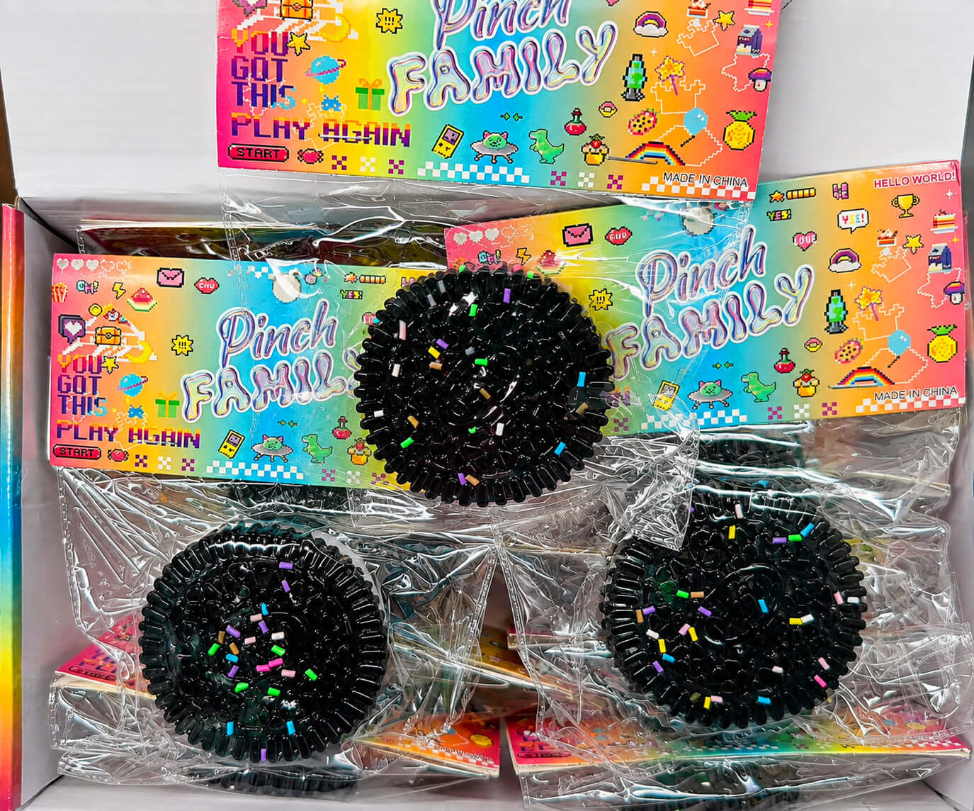 SANDWICH COOKIE SQUISHY products in colorful packaging displayed in a box, perfect for stress relief and sensory play.