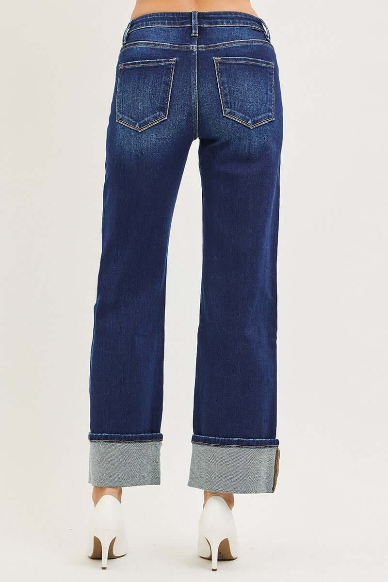 Back view of CHARLEIGH JEANS by Risen, showcasing dark wash cuffed wide-leg design with pockets.