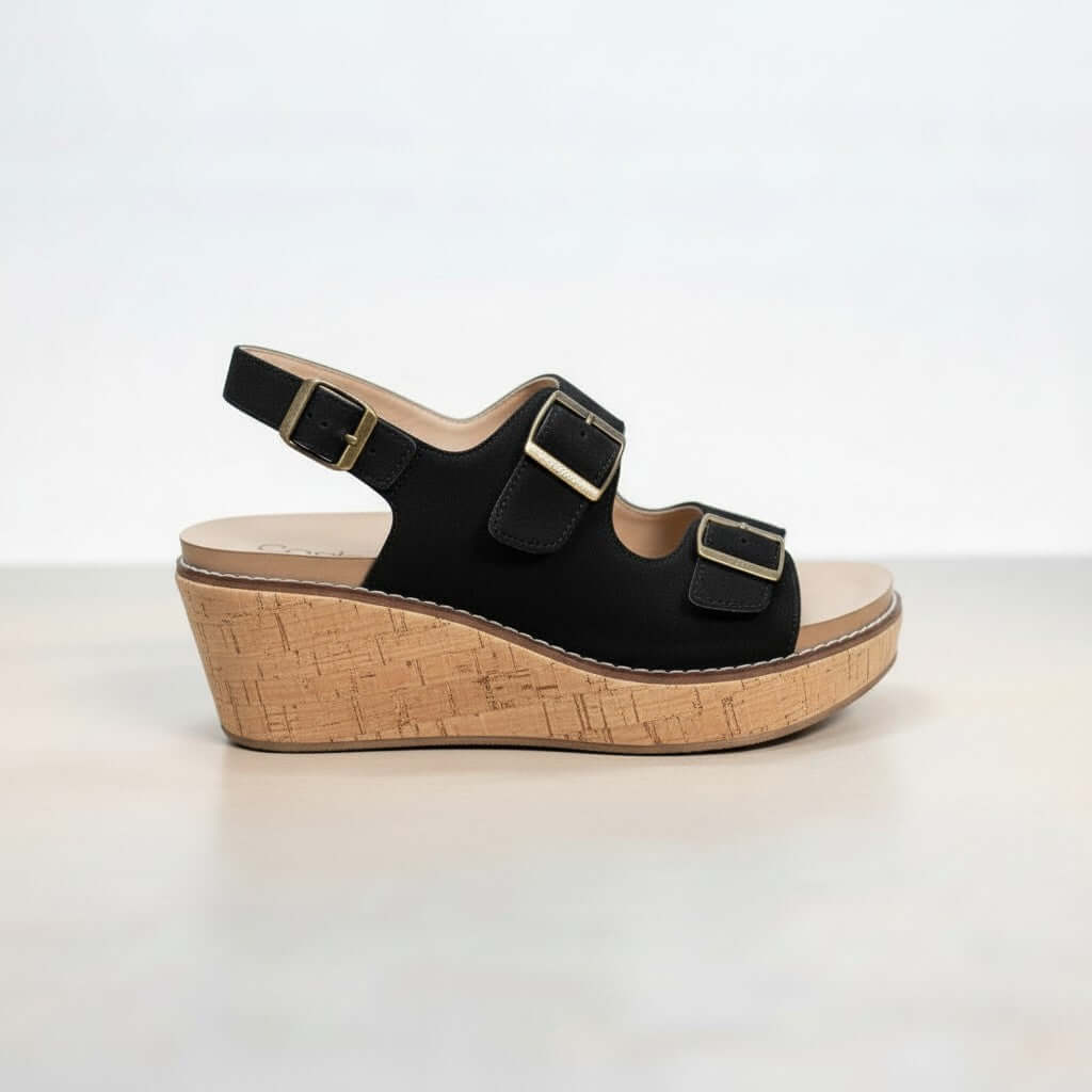 CORKYS MY 2 CENTS WEDGE (blk) side view showcasing black faux suede upper and cork wedge sole with buckles.