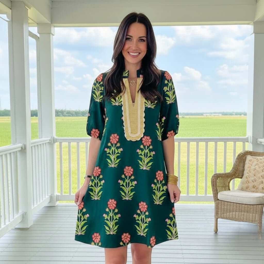 Model wearing RADIATE CONFIDENCE DRESS with floral print, showcasing effortless style and all-day comfort.