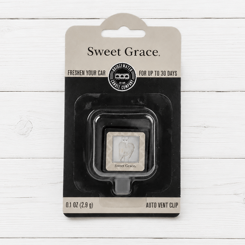 SWEET GRACE VENT CLIP by Bridgewater Candle Company in packaging on a wood background.