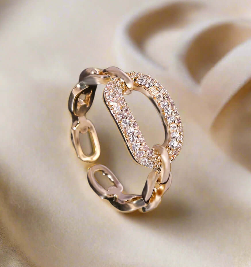 Elegant Run The Course Ring with rhinestones, adjustable gold tone band, perfect for any finger size.