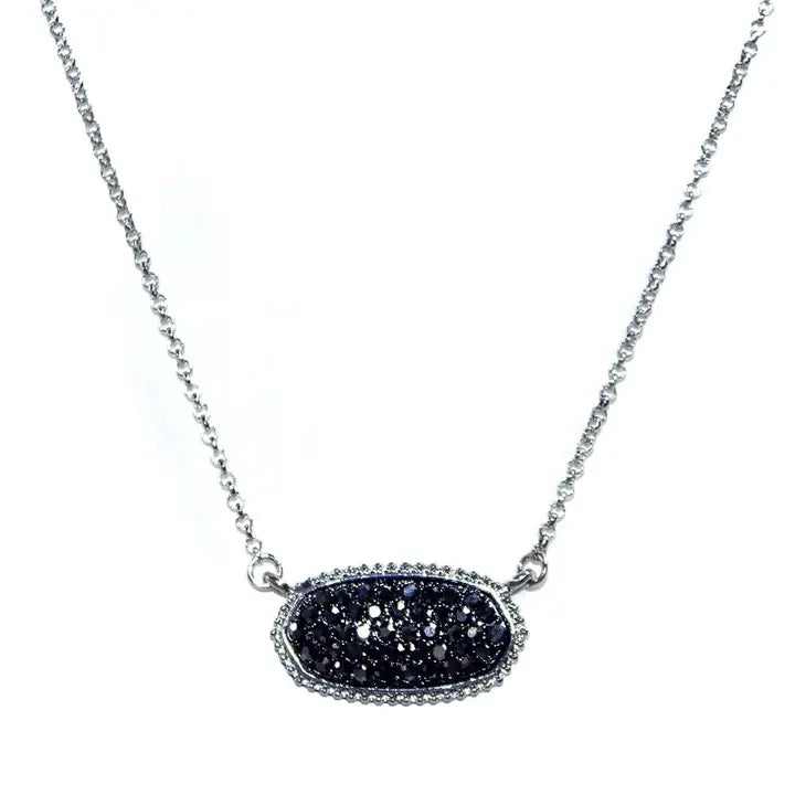 Druzy oval pendant necklace with silver chain, featuring a textured black druzy stone for a sparkling elegance.