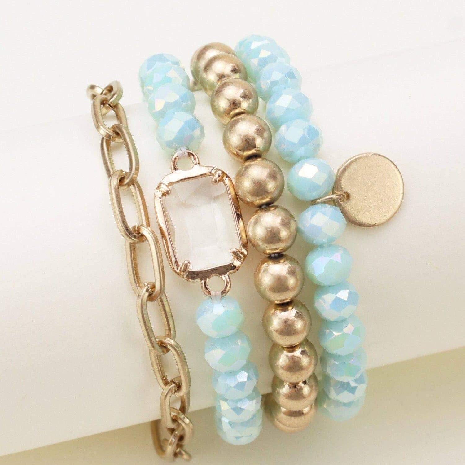 Prism Collection 4-piece bracelet set featuring sparkly pastel beads and metallic accents.