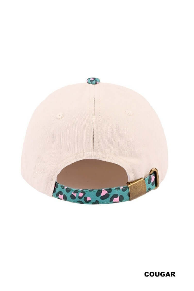 Back view of the SORRY ABOUT MY HUSBAND HAT (6 colors) featuring a cream base and leopard print strap.