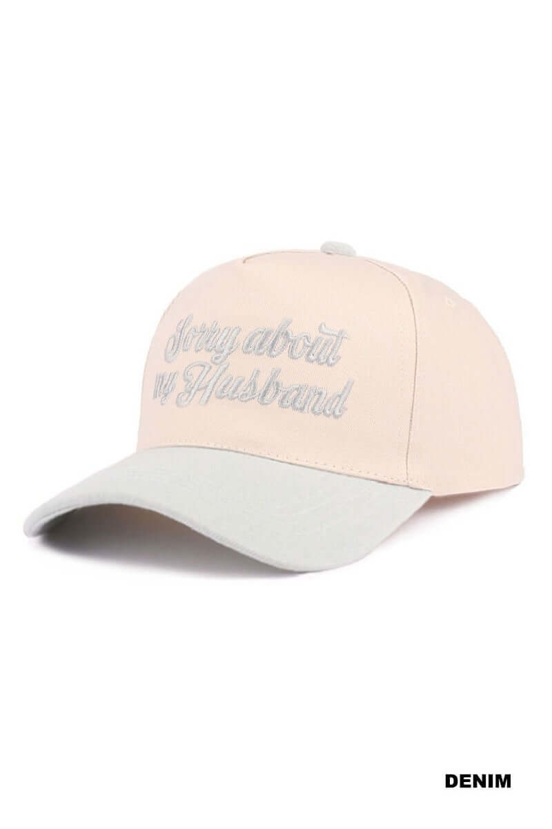 SORRY ABOUT MY HUSBAND HAT (6 colors) in cream with embroidered text for a fun and sassy statement.
