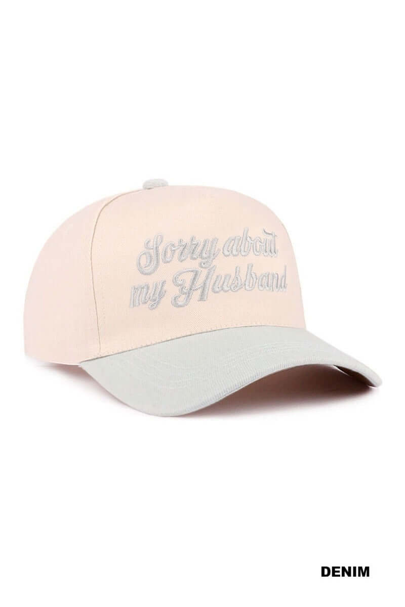 SORRY ABOUT MY HUSBAND HAT (6 colors) in light pink with gray bill and embroidered text.
