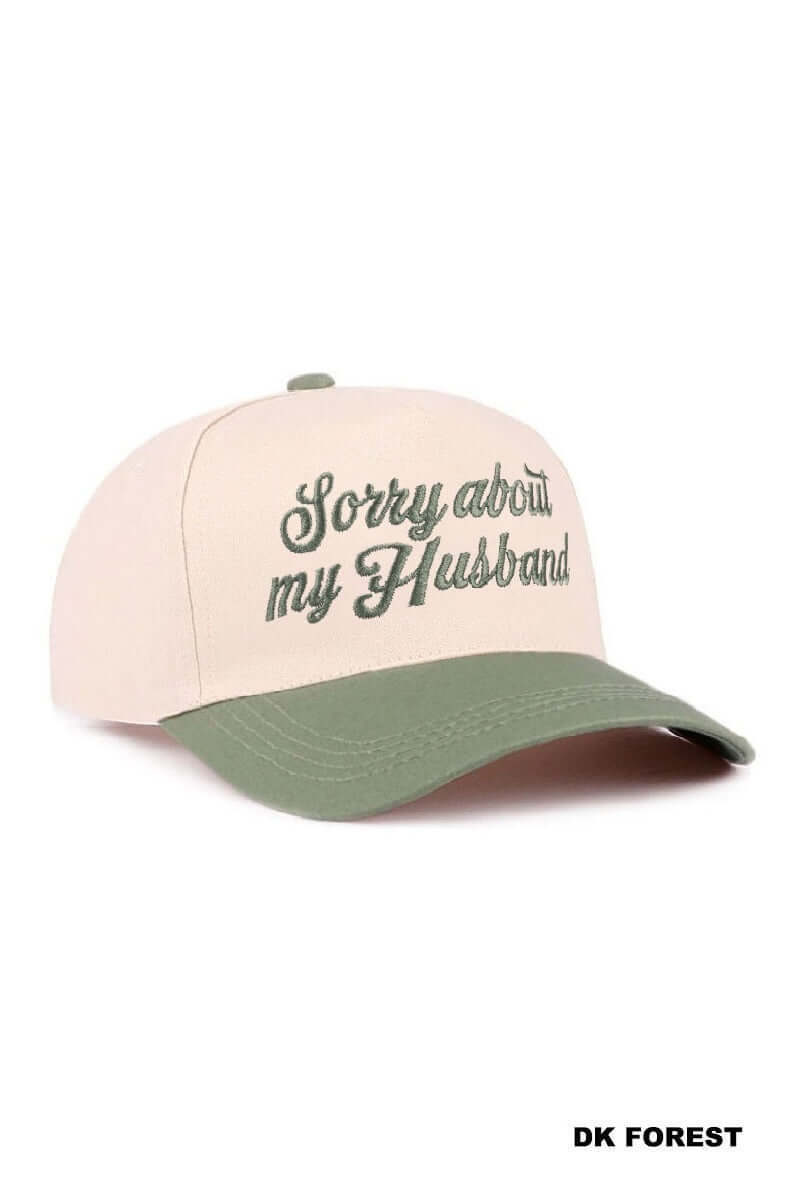 SORRY ABOUT MY HUSBAND HAT (6 colors) in cream and dark green, featuring playful script for a fun, casual accessory.