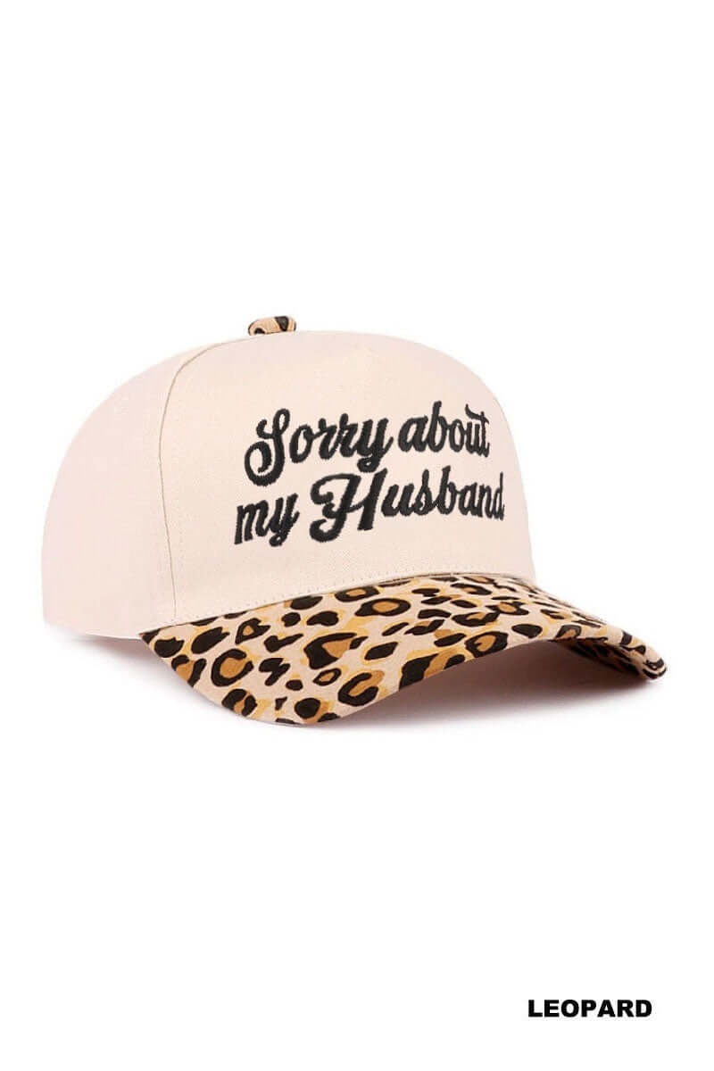 SORRY ABOUT MY HUSBAND HAT (6 colors) in leopard print with cream base and embroidered text for a fun casual look.