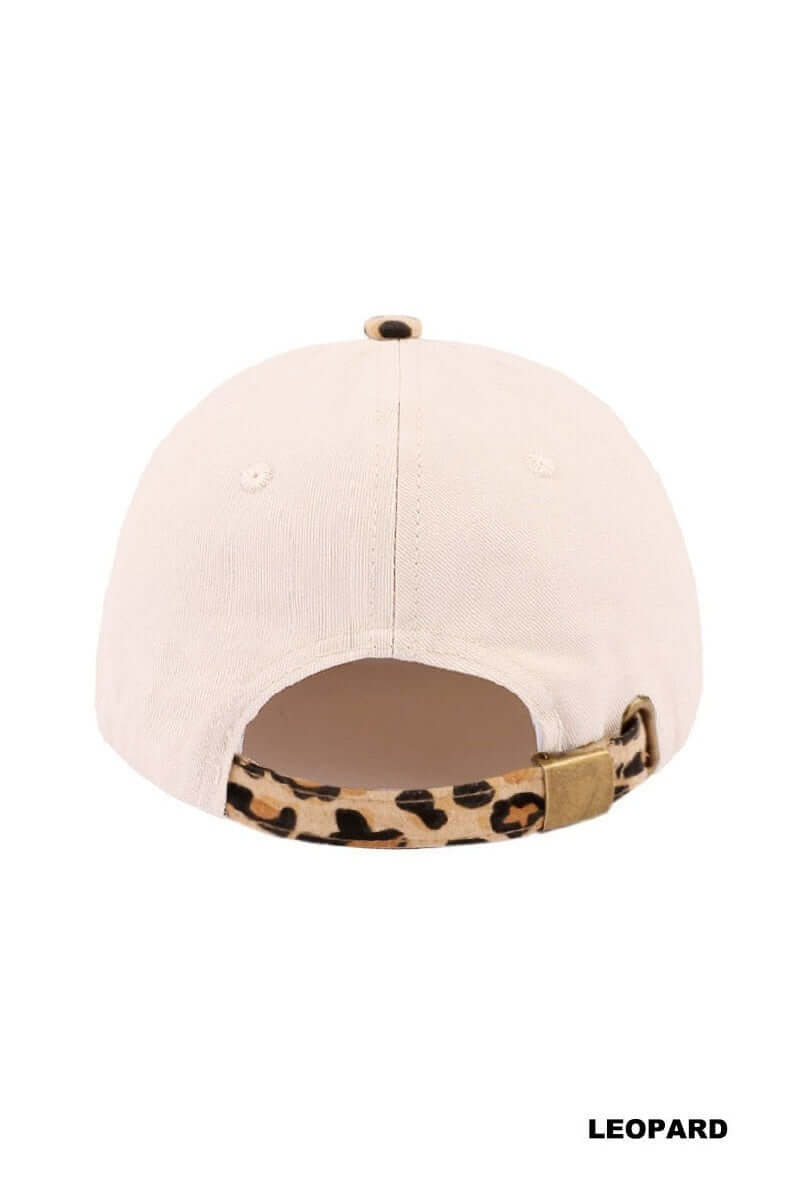 Back view of the SORRY ABOUT MY HUSBAND HAT (6 colors) featuring a cream base and leopard print strap.