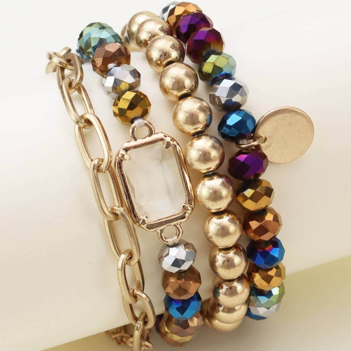 Prism Collection 4-piece bracelet set featuring colorful faceted beads and a metallic finish.