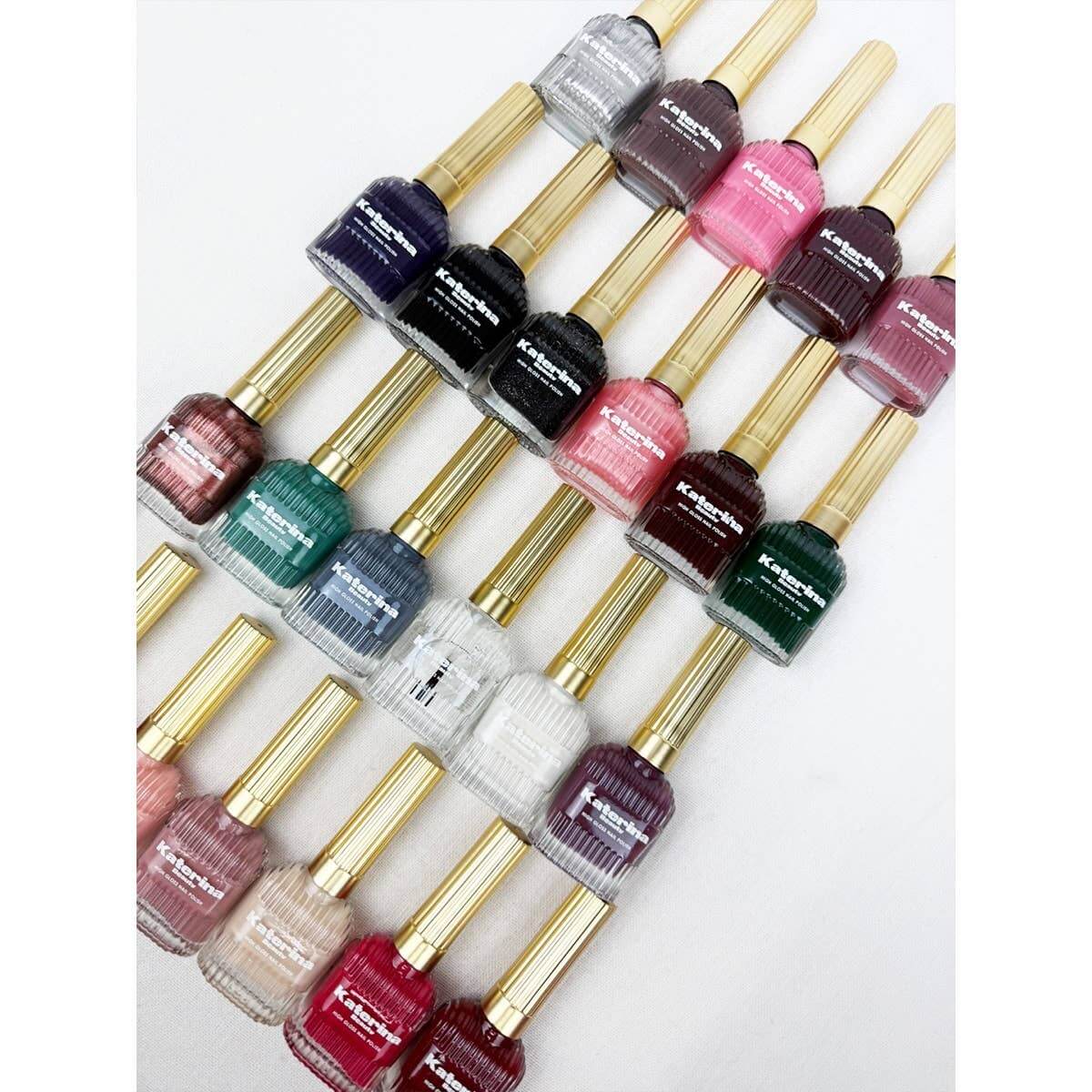Colorful collection of SHINE EFFECT quick dry nail polishes in various shades with elegant gold caps.