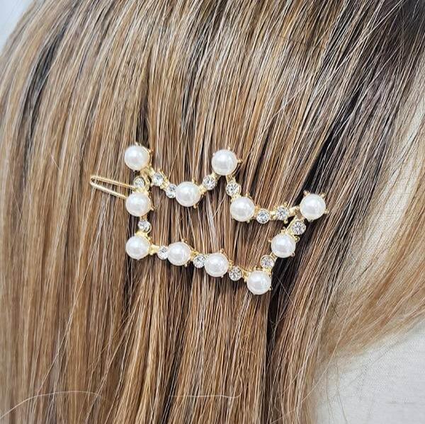 Gold crown barrette adorned with faux pearls and rhinestones, perfect for holiday styling.