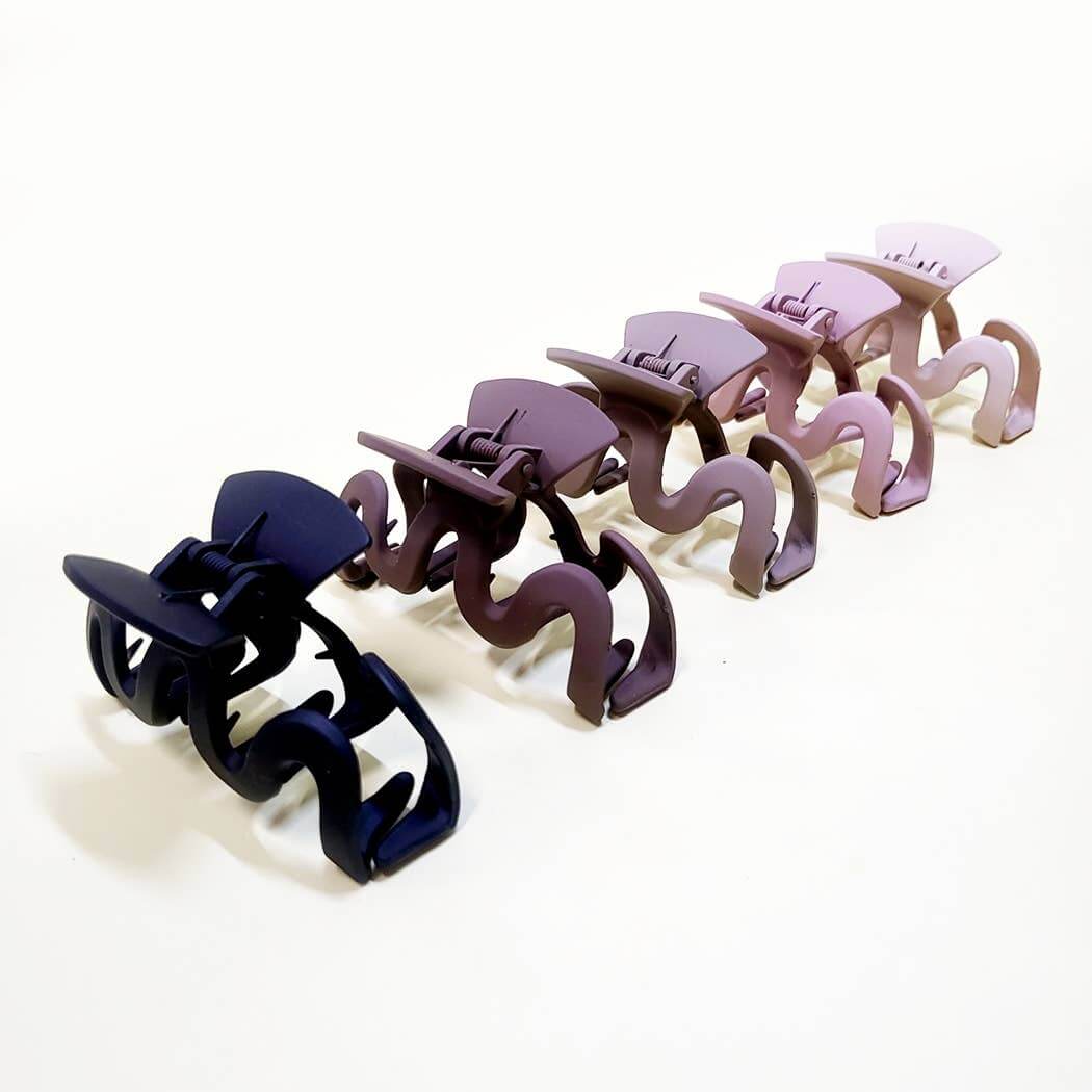 Set of Curve Appeal hair clips in five trendy matte colors for stylish hair styling.