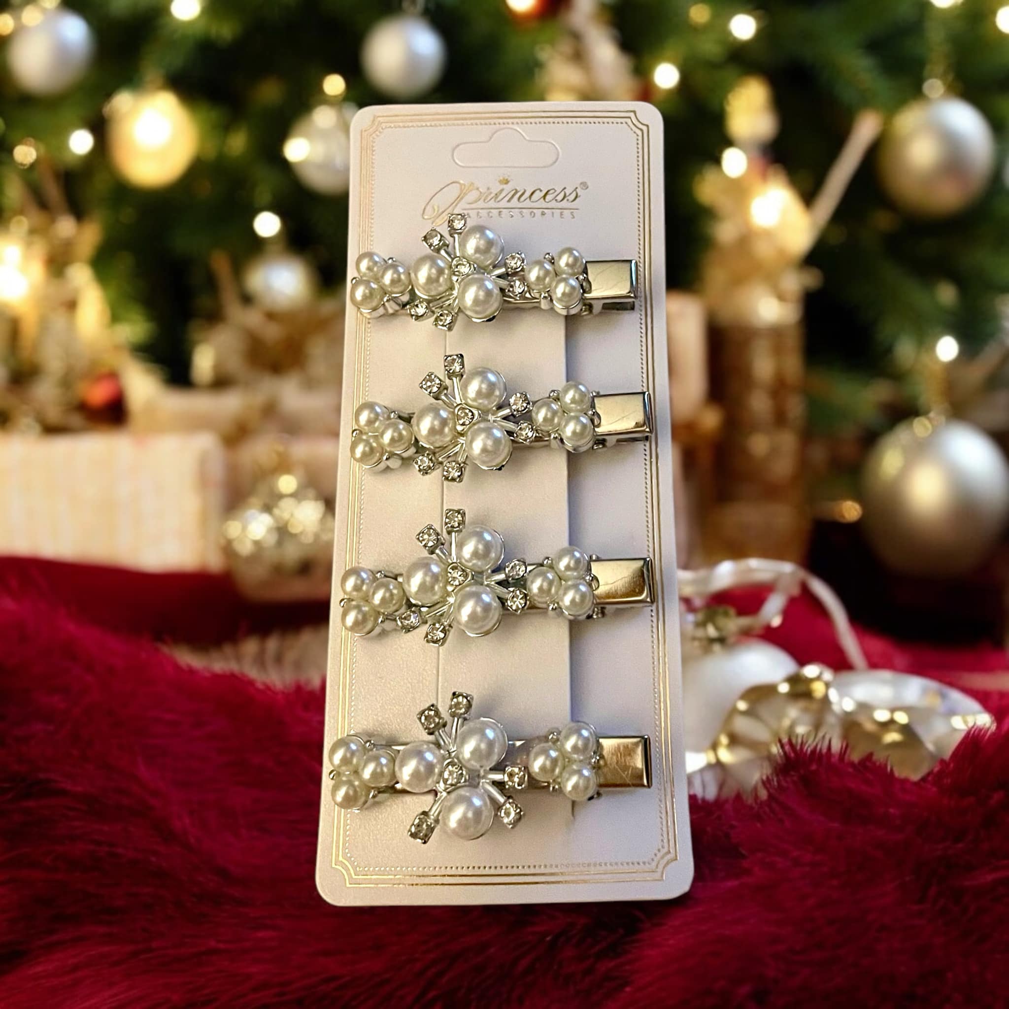 Four piece pearl and rhinestone hair clip set on display, perfect for holiday elegance in gold or silver.