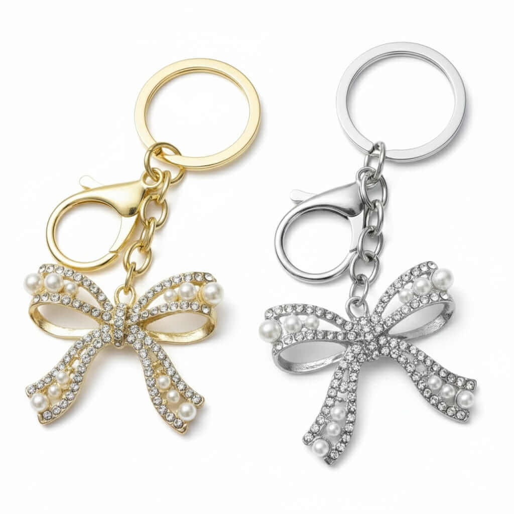 ENCHANTED BOW Bag Charm / Keychain in gold and silver with rhinestones and faux pearls, perfect for adding sparkle.