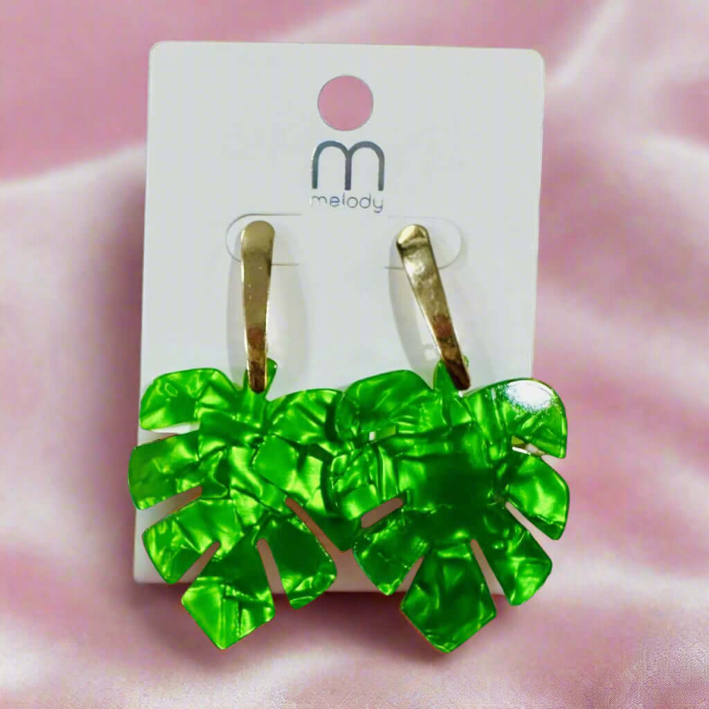 Palm Parade Earrings in green monstera leaf design with gold-tone stems, perfect for tropical style.