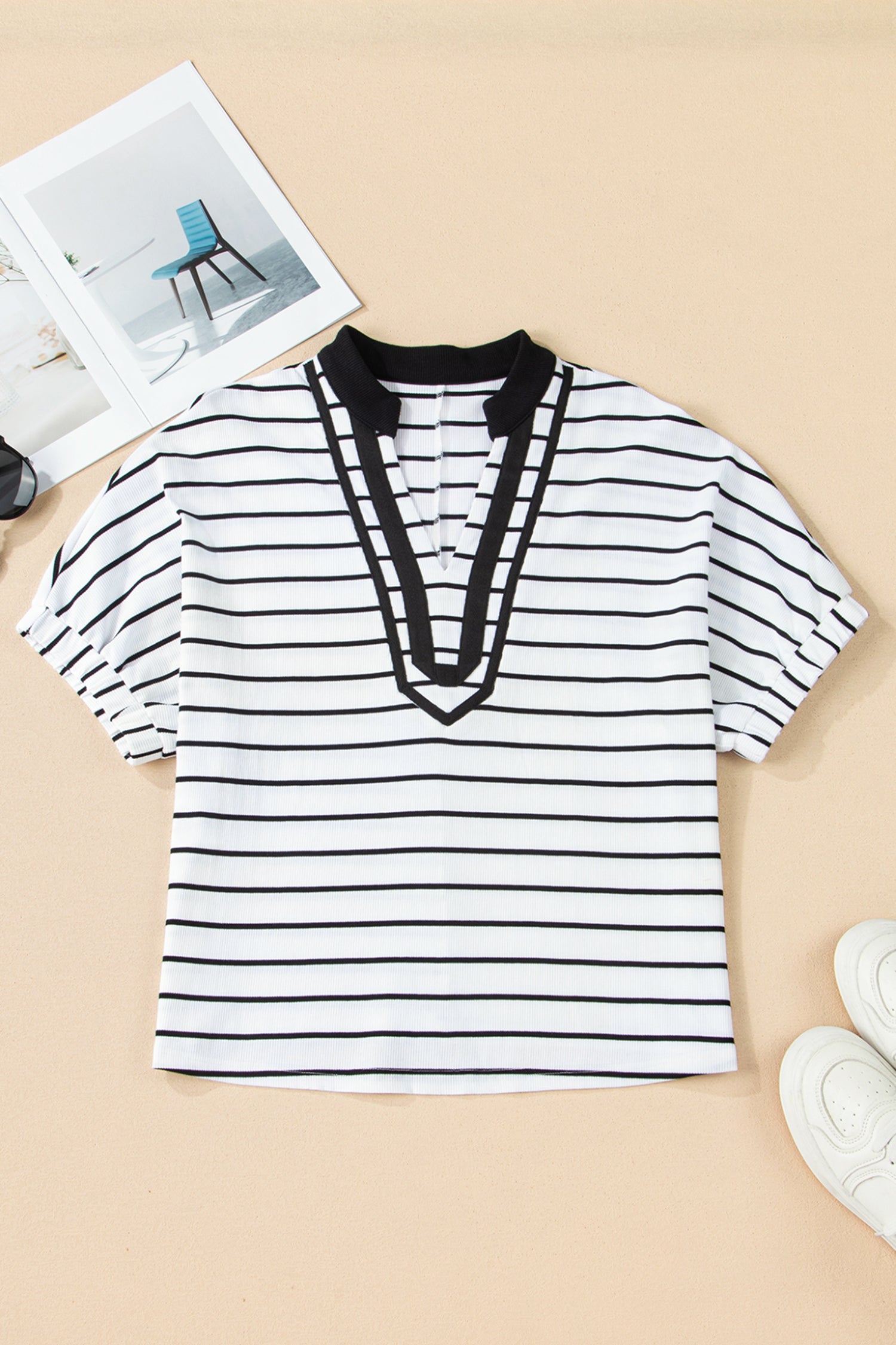 PARALLEL POISE Top in white and black stripes featuring a defined V-neck and dolman sleeves for a flattering fit.