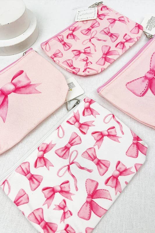 BOW ME OVER COSMETICS BAG collection featuring pink bow designs perfect for organizing makeup essentials.