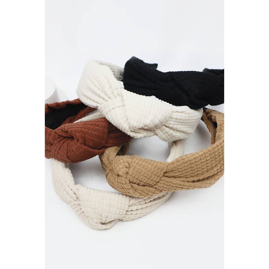 Set of four Knot Your Average Headbands in neutral tones with a thick waffle texture and stylish knotted design.