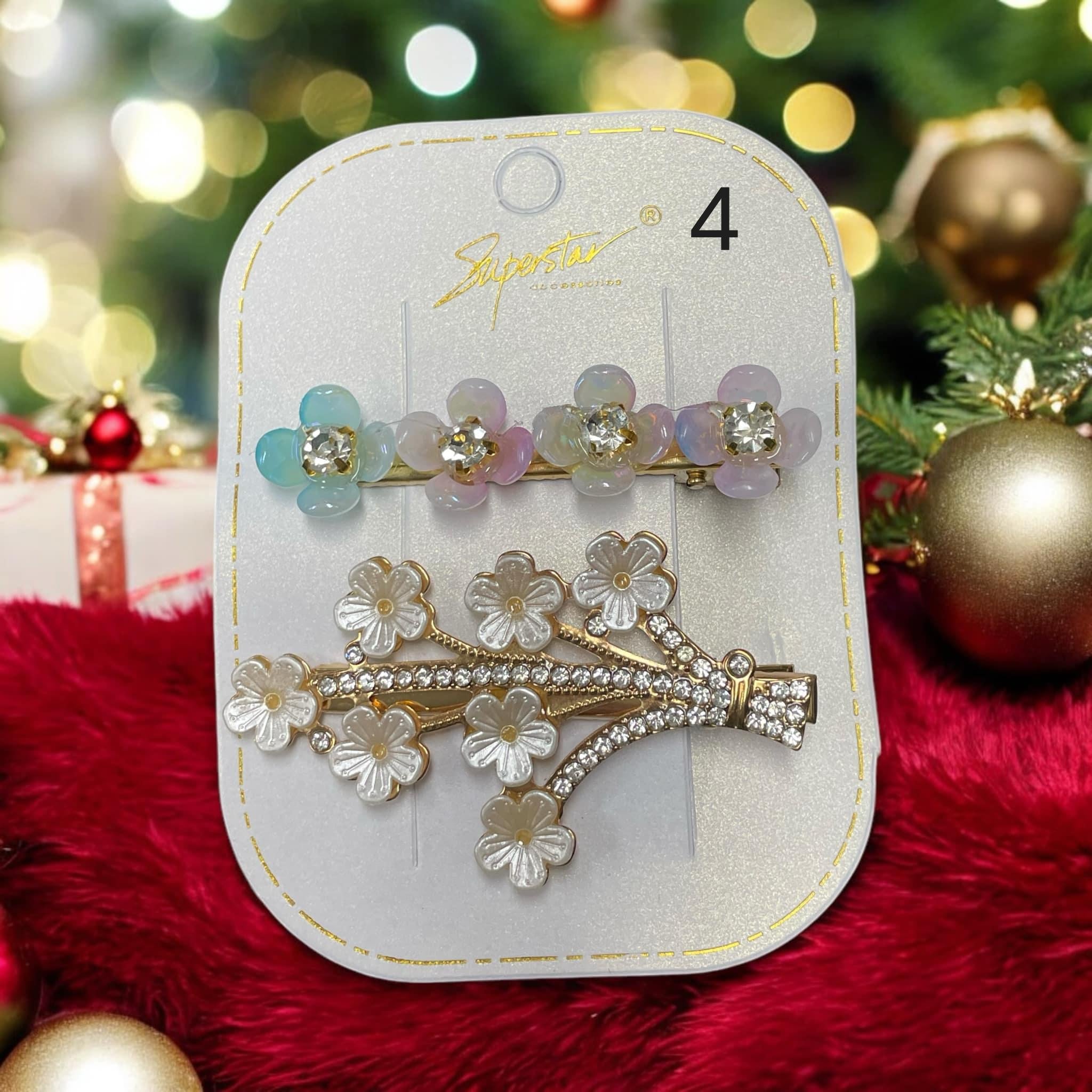 Set of two Superstar Bejeweled hair clips featuring rhinestone and flower designs, ideal for chic holiday styling.