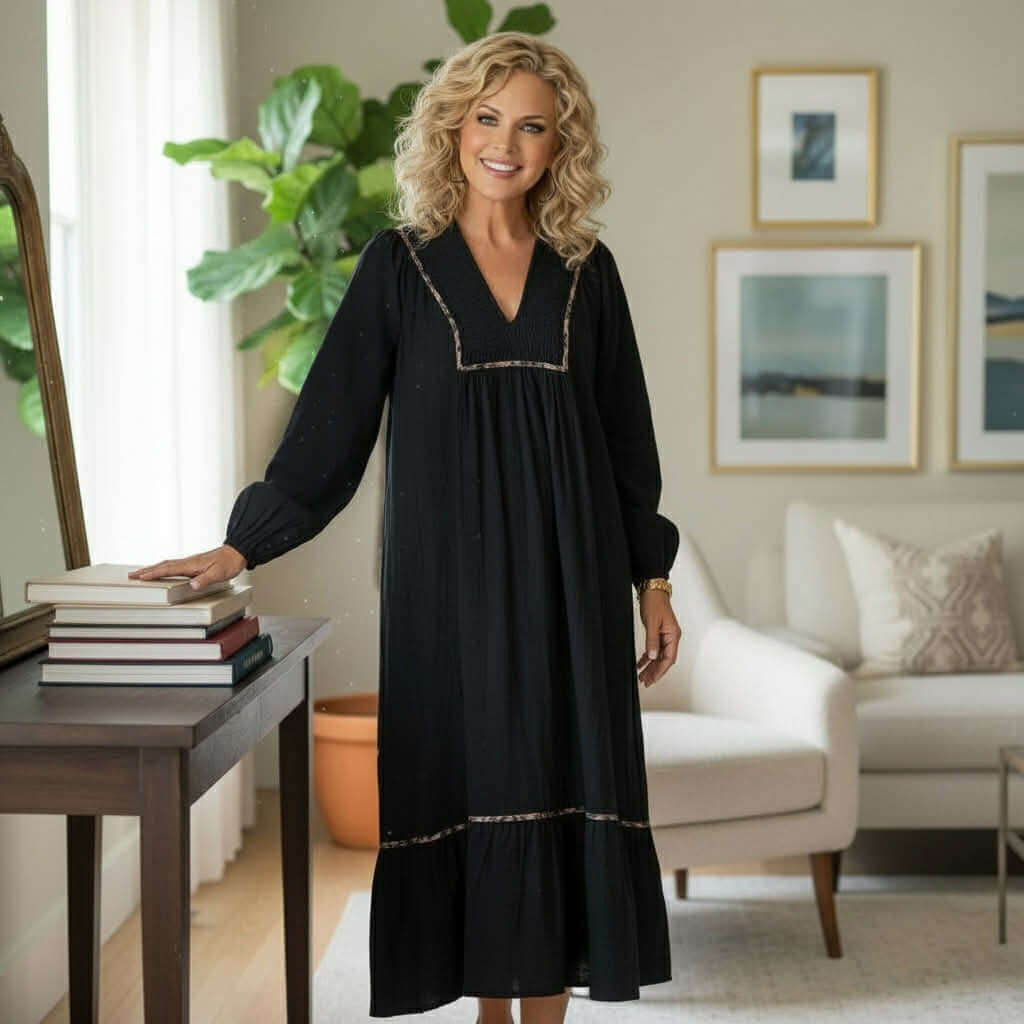 GRACEFUL INSTINCTS MAXI DRESS model showcasing black collared smocked detail maxi with leopard trim in a stylish setting.