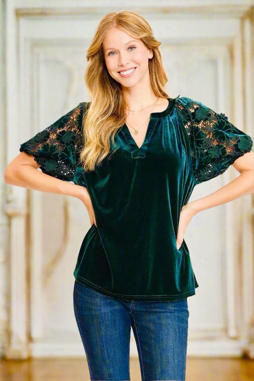 Model wearing Umgee's QUIET JOY Velvet Top in Dark Teal with lace sleeves, showcasing luxurious style and elegant design.