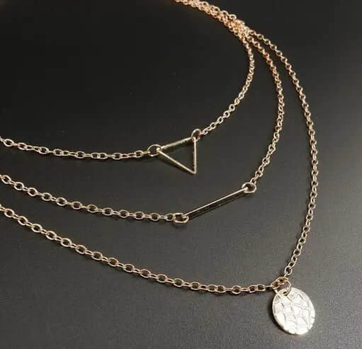 Shapes of Life Necklace Set featuring a triangle, bar, and circle pendant in gold, perfect for modern style.