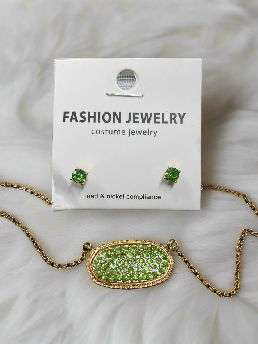 Druzy oval pendant and stud earrings in green, showcasing elegant costume jewelry on a display card.