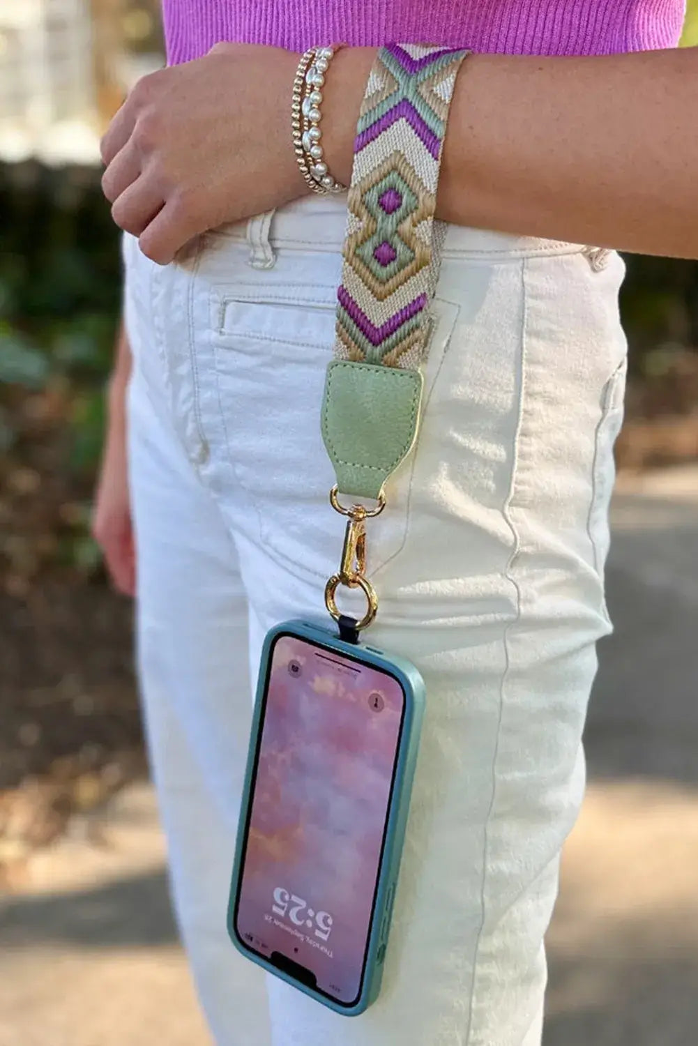 Hands-Free Harmony Crossbody featuring a geometric strap, mint green pouch, and phone holder for stylish convenience.
