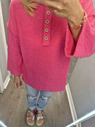 Model wearing CASUAL CHARM TOP - Zenana in pink with relaxed fit, button details, paired with jeans and sandals.