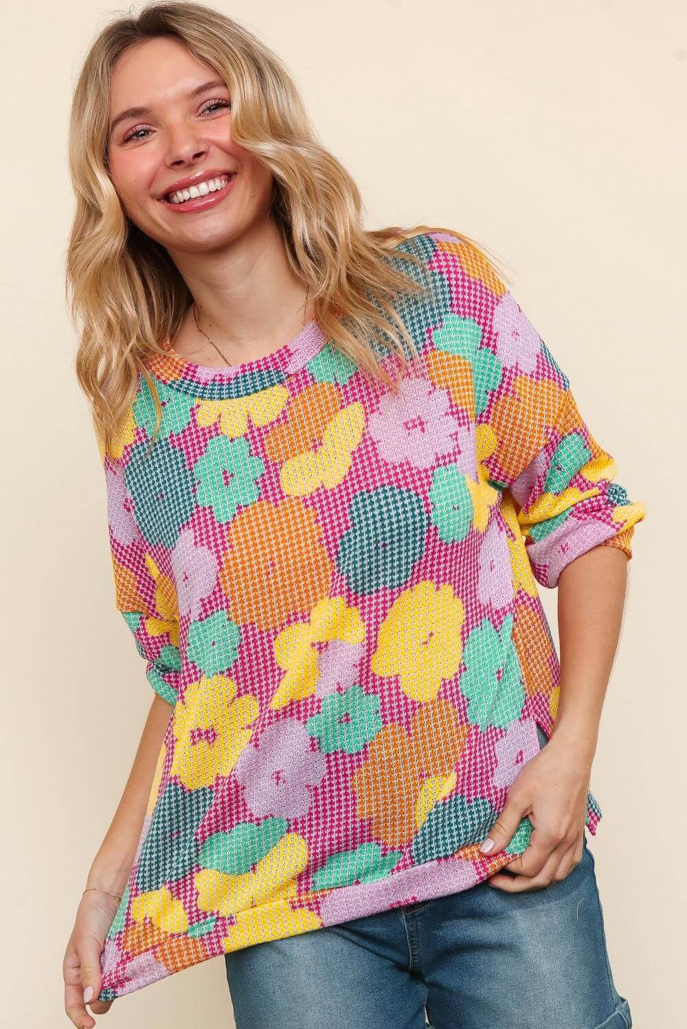 Smiling woman in colorful floral Happy Daze Top by Haptics, perfect for summer to fall transition.