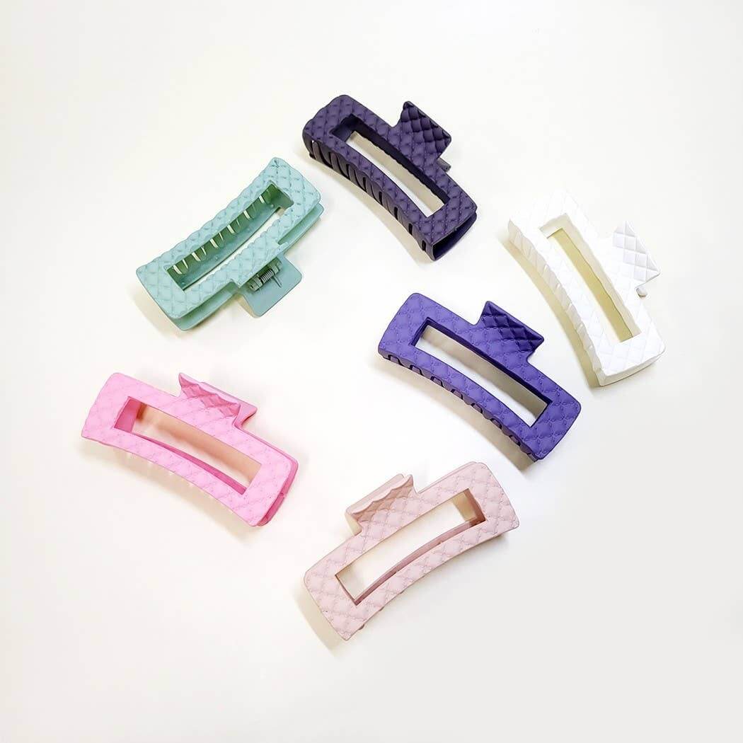 Everyday Luxe XL hair clips in 6 colors: green, purple, pink, and white, featuring a matte embossed design.