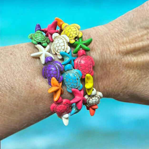 Colorful Tidepool Treasures Bracelet featuring turtle and starfish beads, showcasing coastal charm and playful design.
