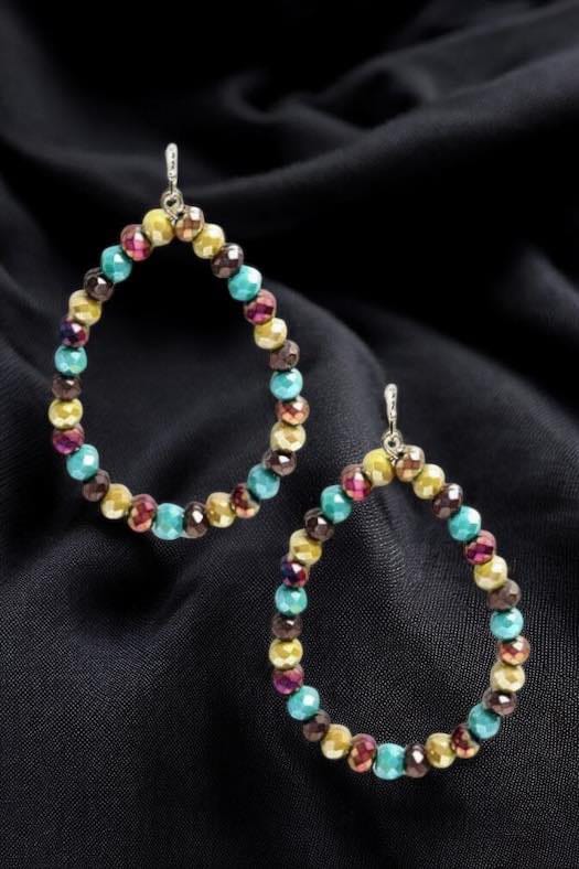 Colorful Faith Beaded Teardrop Earrings on a black fabric background, showcasing an elegant design by No. 3 Jewelry.