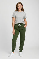 Model wearing OLIVE YOU JOGGERS with a grey t-shirt, showcasing the relaxed style and comfortable fit of the jogger pants.