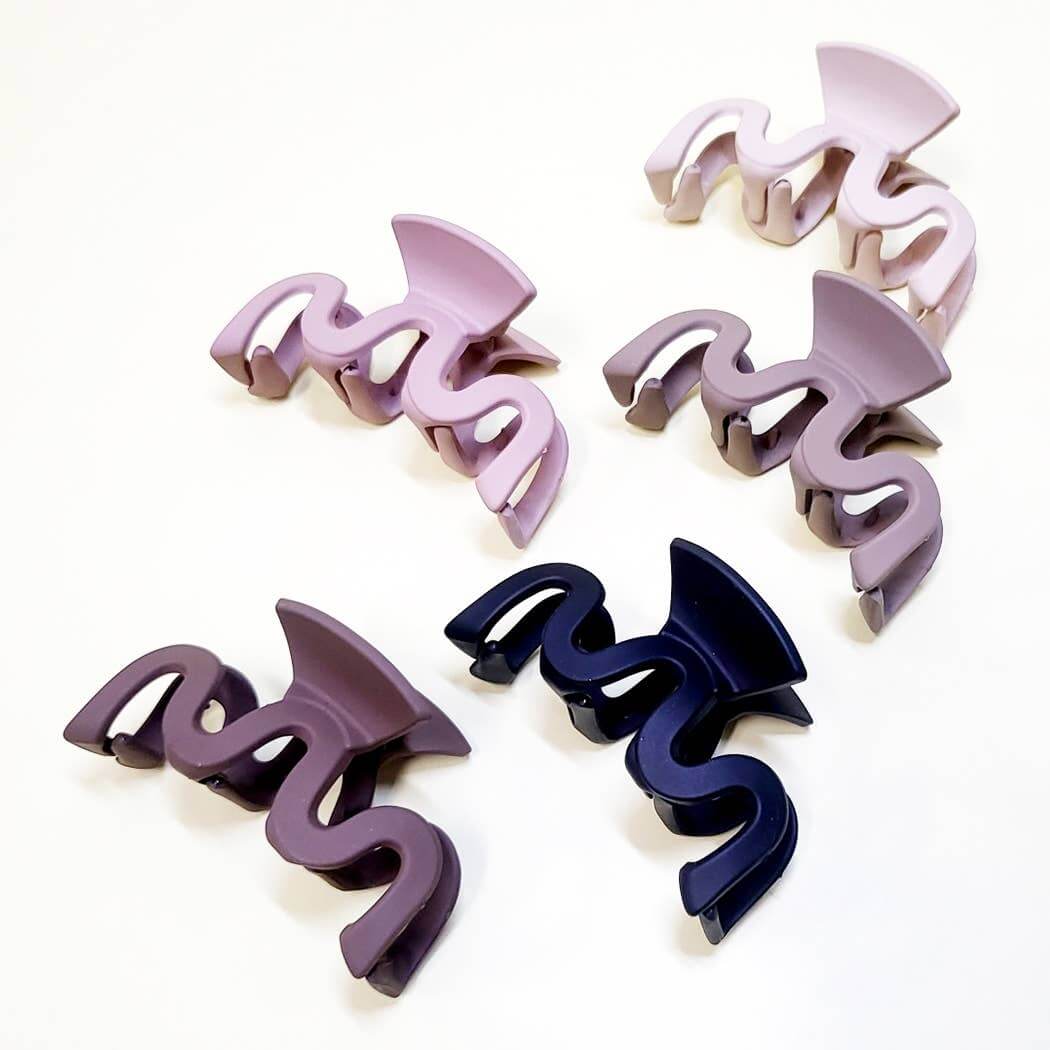 Curve Appeal Hair Clips in five stylish colors, featuring a 3.375-inch wavy design for secure hair styling.