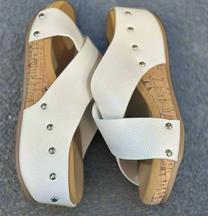 Stylish Sugar Stroll wedge sandals with textured white faux leather and cork sole, perfect for summer outings.