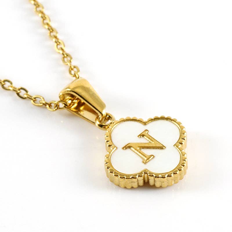 MONOGRAM MOMENTS NECKLACE featuring a gold pendant with a white background and the letter N.
