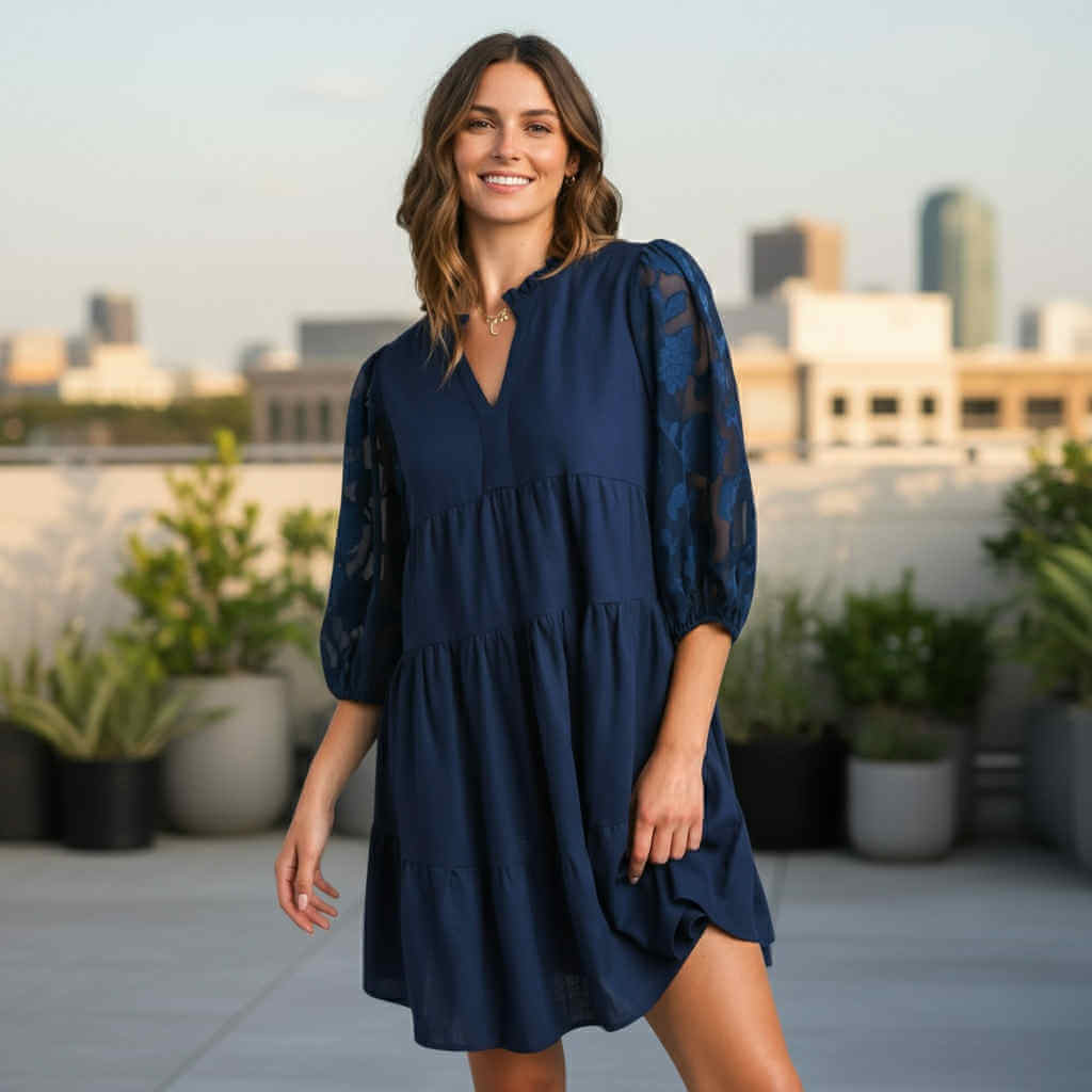 DEEP SEA DREAMS DRESS Umgee in navy, featuring floral 3/4 sleeves and a tiered silhouette, ideal for casual and dressy occasions.