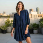 DEEP SEA DREAMS DRESS Umgee in navy, featuring floral 3/4 sleeves and a tiered silhouette, ideal for casual and dressy occasions.