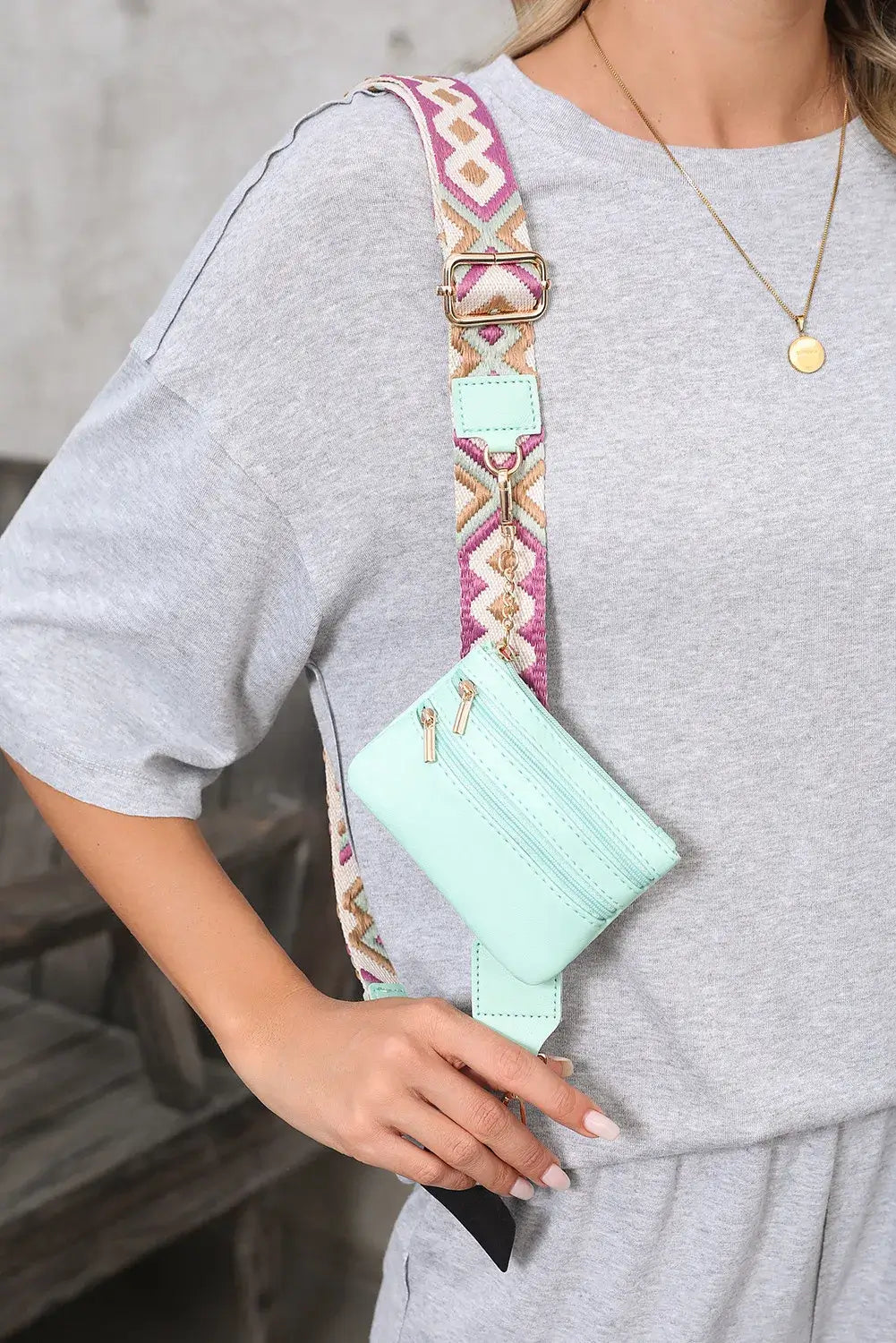 HANDS FREE HARMONY CROSSBODY in mint green with geometric strap, worn casually for errands and everyday outings.