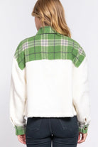 Back view of the ALPINE CHARM JACKET featuring green plaid flannel and cozy sherpa fabric.