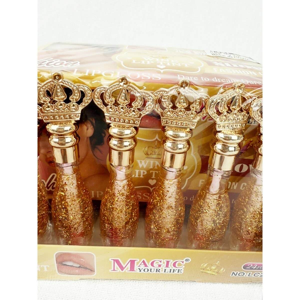 Champagne Nights lip color collection in regal crown packaging, showcasing slow-changing lip tint with sparkle.