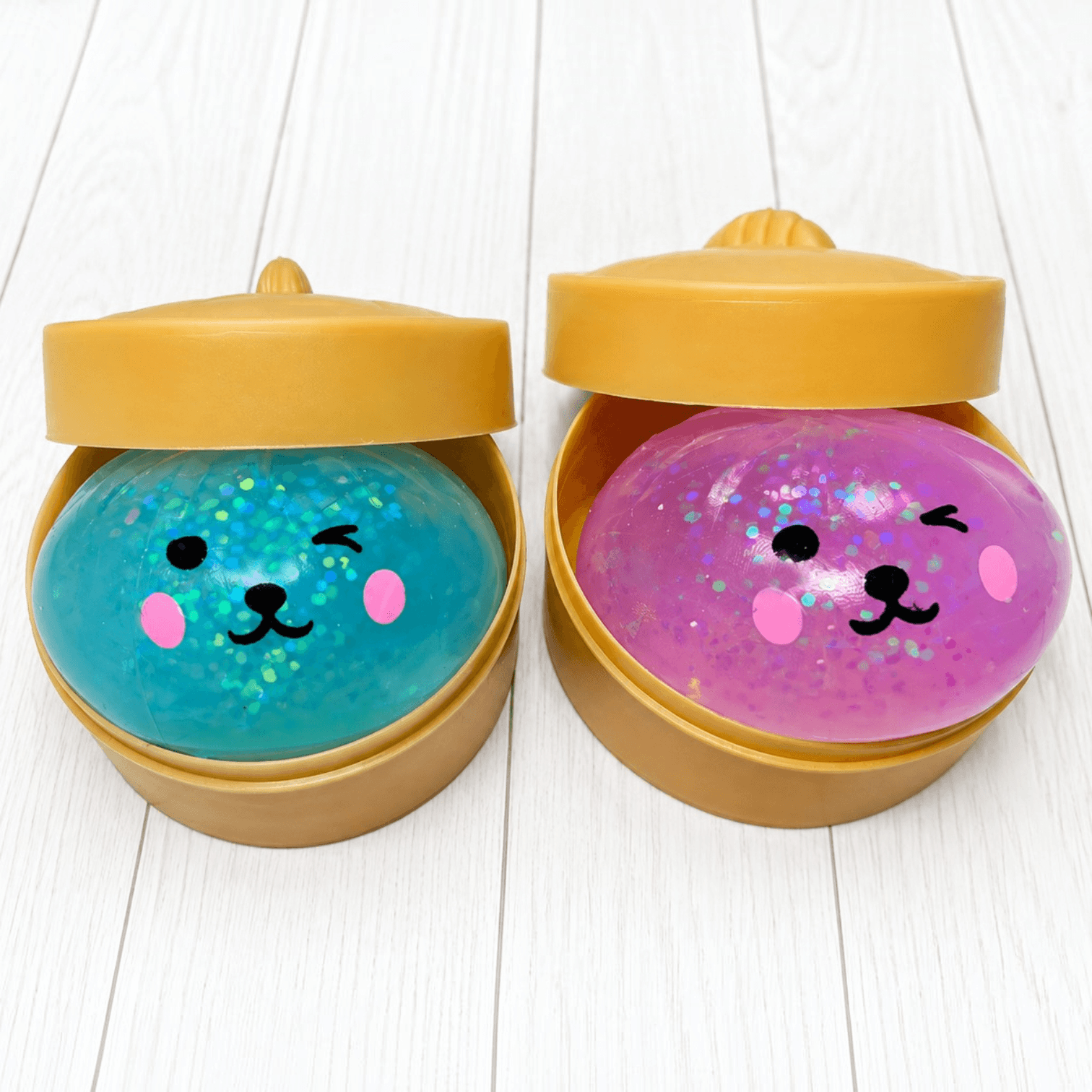 LIL PET FACE GLITTER DUMPLINGS in colorful packaging, featuring cute faces and sparkling glitter filling.