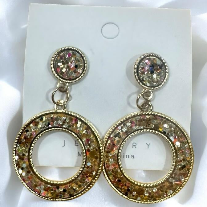 Confetti Dazzle Earrings with sparkling glitter in a resin-filled open circle design, available in six vibrant colors.
