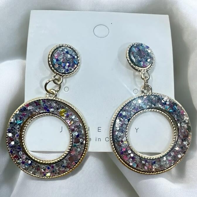 Sparkling Confetti Dazzle Earrings featuring a circular design filled with colorful glitter in vibrant shades.